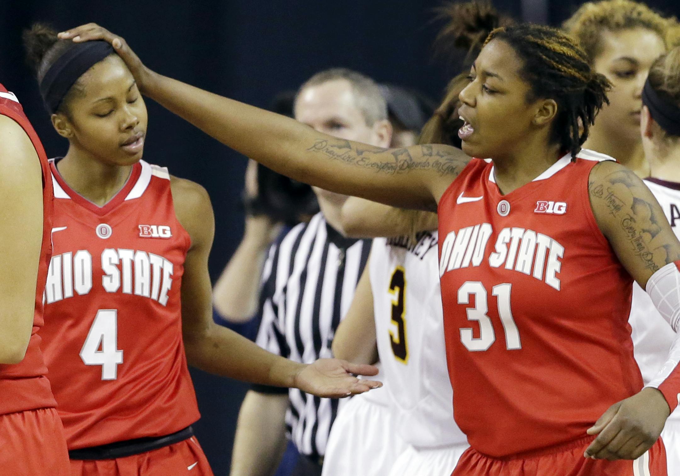 Ohio State guard Tayler Hill, left, celebrates with Raven Ferguson after scoring during the second half of an NCAA college basketball game against Minnesota in the Big Ten Conference women's tournament in Hoffman Estates, Ill., on Thursday, March 7, 2013. Ohio State won 58-47. (AP Photo/Nam Y. Huh) ORG XMIT: MIN2013030720245195