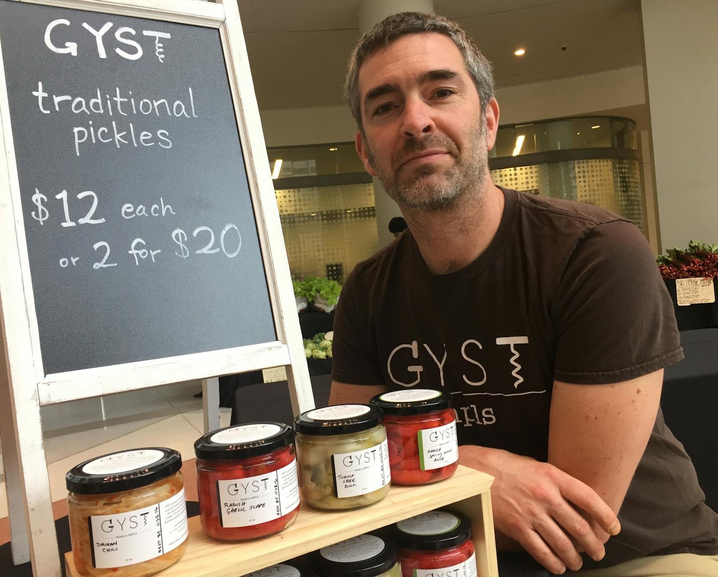 Jim Bovino, of Gyst Fermentation Bar in Minneapolis, sells a selection of the restaurant&#x2019;s naturally fermented pickles at the Wednesday farmers market inside Capella Tower in downtown Minneapolis. Gyst also operates a stand on Sundays at the Linden Hills Farmers Market in Minneapolis.