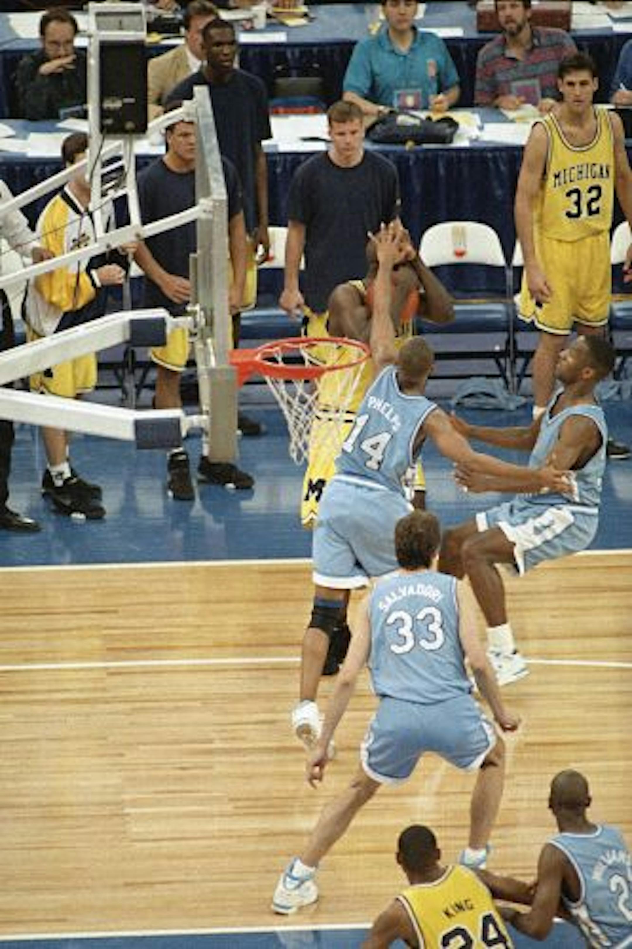 Michigan's Chris Webber, guarded by North Carolina's Derrick Phelps, called for a timeout in the closing moments of the NCAA final at the Superdome in New Orleans on April 5, 1993. Webber was called for a technical foul because they had no time outs left and North Carolina went on to win 77-71.