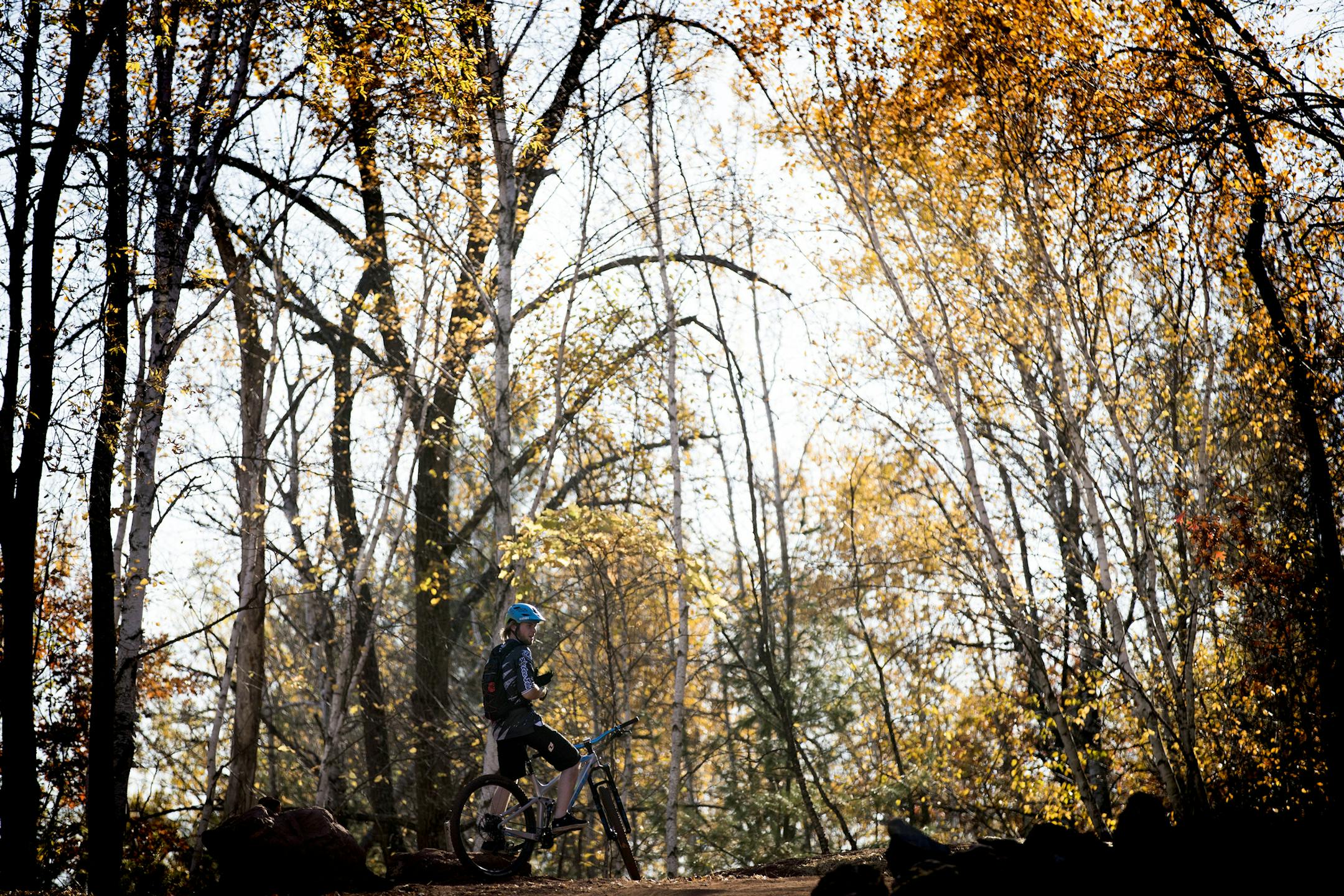 A biker gets ready to ride the trails at Cuyuna Country State Recreation Area. ] LEILA NAVIDI &#xef; leila.navidi@startribune.com BACKGROUND INFORMATION: People ride the mountain bike trails at Cuyuna Country State Recreation Area near the communities of Crosby and Ironton on Friday, October 13, 2017. A popular mountain bike trail carved five years ago into a derelict ore mine in northern Minnesota drew tens of thousands of tourists this summer, pumping up the local economy in Crosby-Ironton as