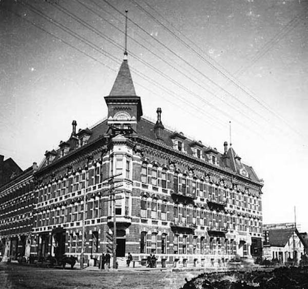 The massive Harmonia Hall, pictured in 1885, was built in Minneapolis in the 1880s. Once a grand concert hall, it ended like as a rooming house. (Cour