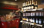 After shopping in the Otsego Super Target Wednesday afternoon, Geralynn Rhoades of Princeton stepped into the liquor store to pick up some champagne t