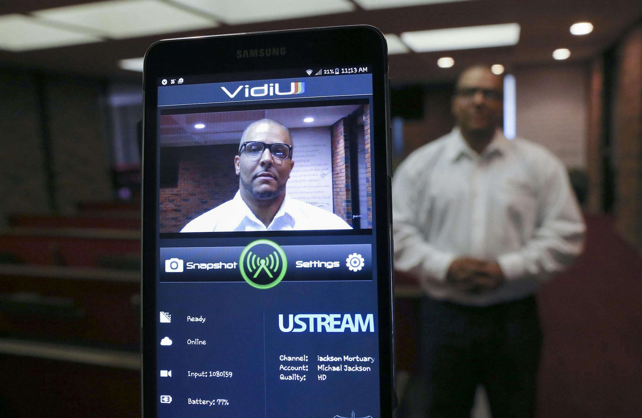 Torrance Jackson started live streaming funerals for The Jackson Mortuary about a year ago and has now done it for about 40 out of the 200 funerals they've performed in the past year. He uses a small camera and tablet for the live stream. (Travis Heying/Wichita Eagle/TNS) ORG XMIT: 1180484