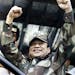 FILE - In this May 20, 1988 file photo, Panamanian military strongman Gen. Manuel Noriega raises his fists to acknowledge the crowd cheers during a Di