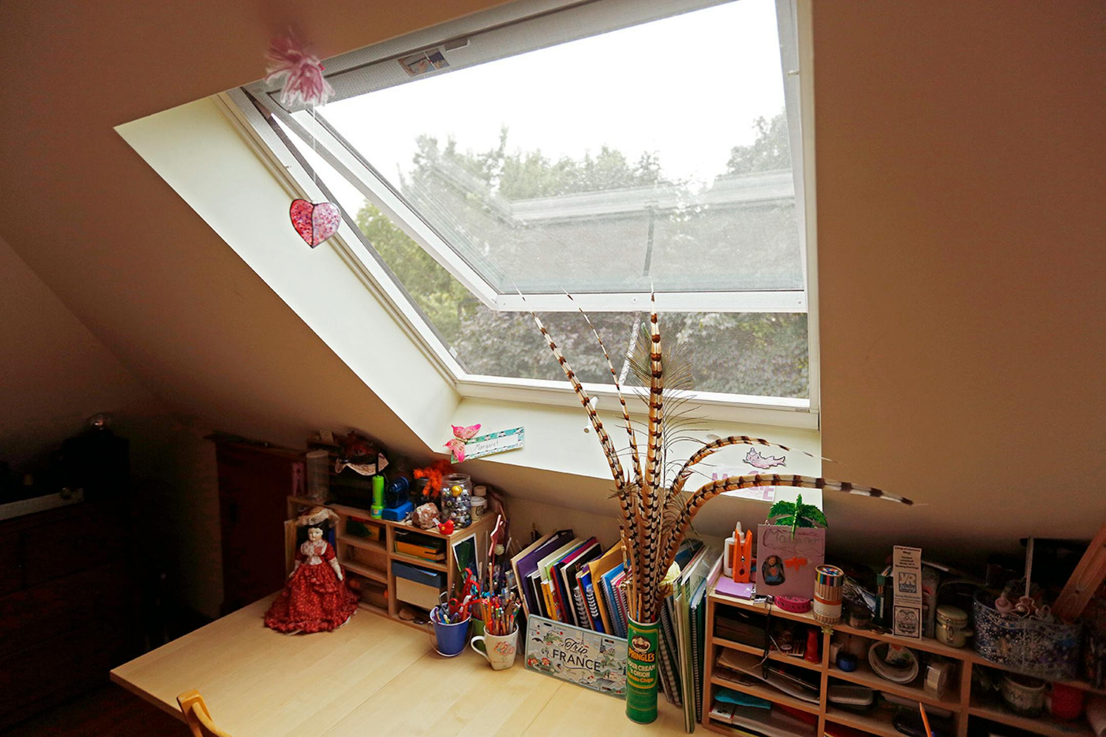 A new skylight cut into the wall lets in light and breezes. There's enough space for a homework and craft desk in the Durant's finished attic.