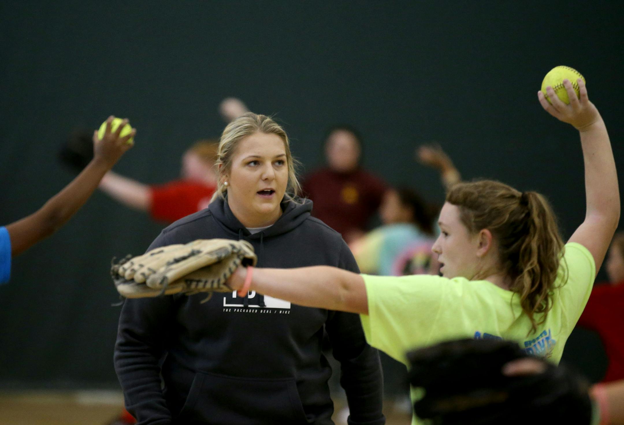 Former Gophers star softball pitcher Sara Groenewegen, who contracted Legionnaires' disease last summer, worked with youngsters at a recent weekend clinic in Cottage Grove.