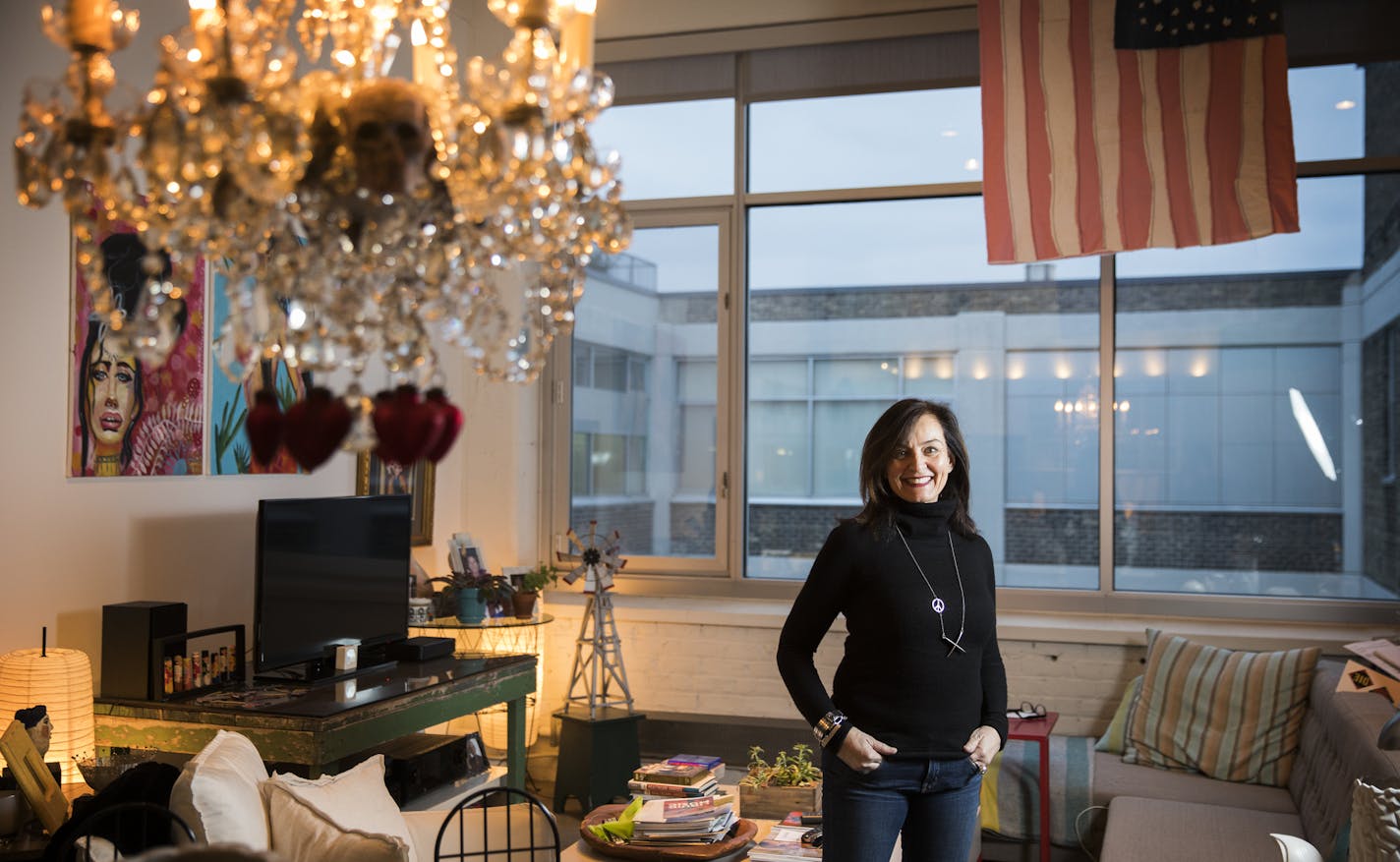 Condo owner Chrysanne Manoles poses inside her condo. ] LEILA NAVIDI &#xef; leila.navidi@startribune.com BACKGROUND INFORMATION: Condo owner Chrysanne Manoles poses for a photo at Tower Lofts in downtown Minneapolis on Thursday, November 2, 2017. Empty nesters are selling the big suburban houses where they raised their kids, choosing downtown condos where they can live like millennials.