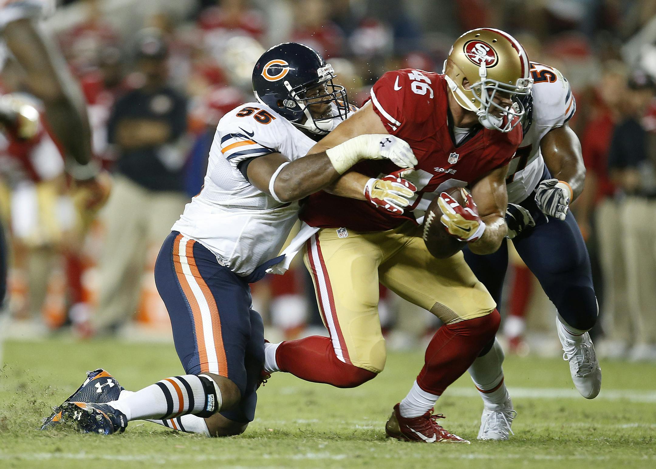 Chicago Bears outside linebacker Lance Briggs (55) tackles San Francisco 49ers tight end Derek Carrier (46) during an NFL football game in Santa Clara, Calif., Sunday, Sept. 14, 2014. (AP Photo/Tony Avelar)