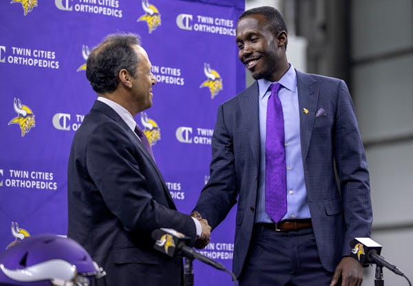 Minnesota Vikings owner and new general manger Kwesi Adofo-Mensah shake hands after a press conference Thursday.