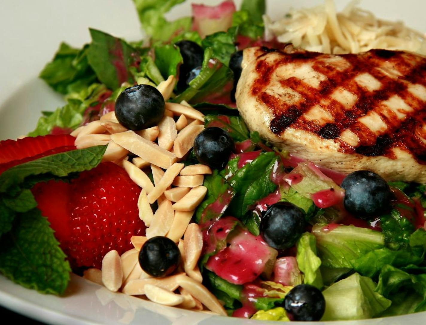 Steve Rice ¥ srice@startribune.com St. Louis Park, 06/20/2007 - Yum! blueberry chicken salad with chicken, midnight moon goat gouda, romaine, blueberries, strawberries and almonds with a blueberry vinaigrette.