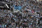 Minnesota United supporters waved their flags and held up their scarves before the start of a game last season.