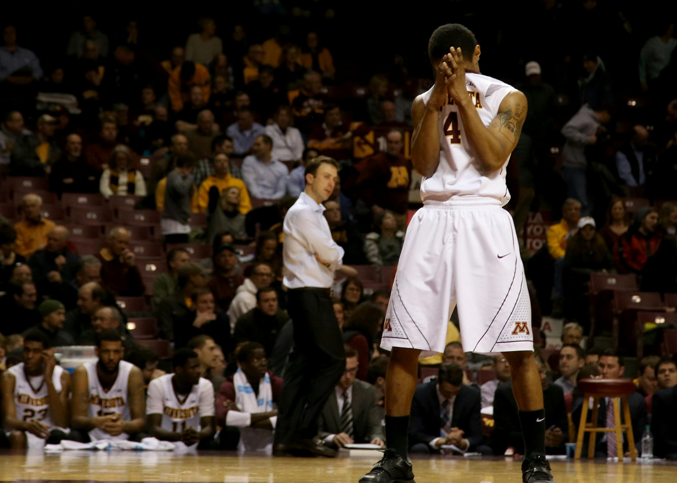 Gopher DeAndre Mathieu wiped his face after another turnover during the second half.