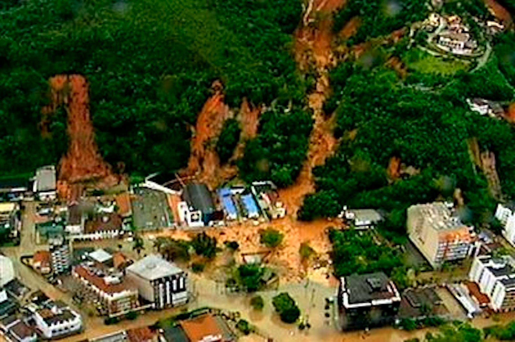 In this frame grab from video is seen an aerial view of a mudslide in Teresopolis, Brazil, Wednesday Jan. 12, 2011.  Torrential rain tore through Rio de Janeiro's mountains, killing at least 64 people in 24 hours, the state's emergency rescue office said Wednesday. The death toll is expected to rise as firefighters reach remote valleys and steep mountainsides where neighborhoods were destroyed by mudslides and flooding, said Jorge Mario Sedlacek, the mayor of Teresopolis, a mountain town just north of Rio where at least 54 people died. About 1,000 there were left homeless. (AP Photo/TV Globo, Agencia O Globo)