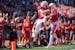 Saint John’s tight end Zach Jungles (39) celebrates with wide receiver Jimmy Buck (11) after Jungles scored a touchdown in the third quarter against