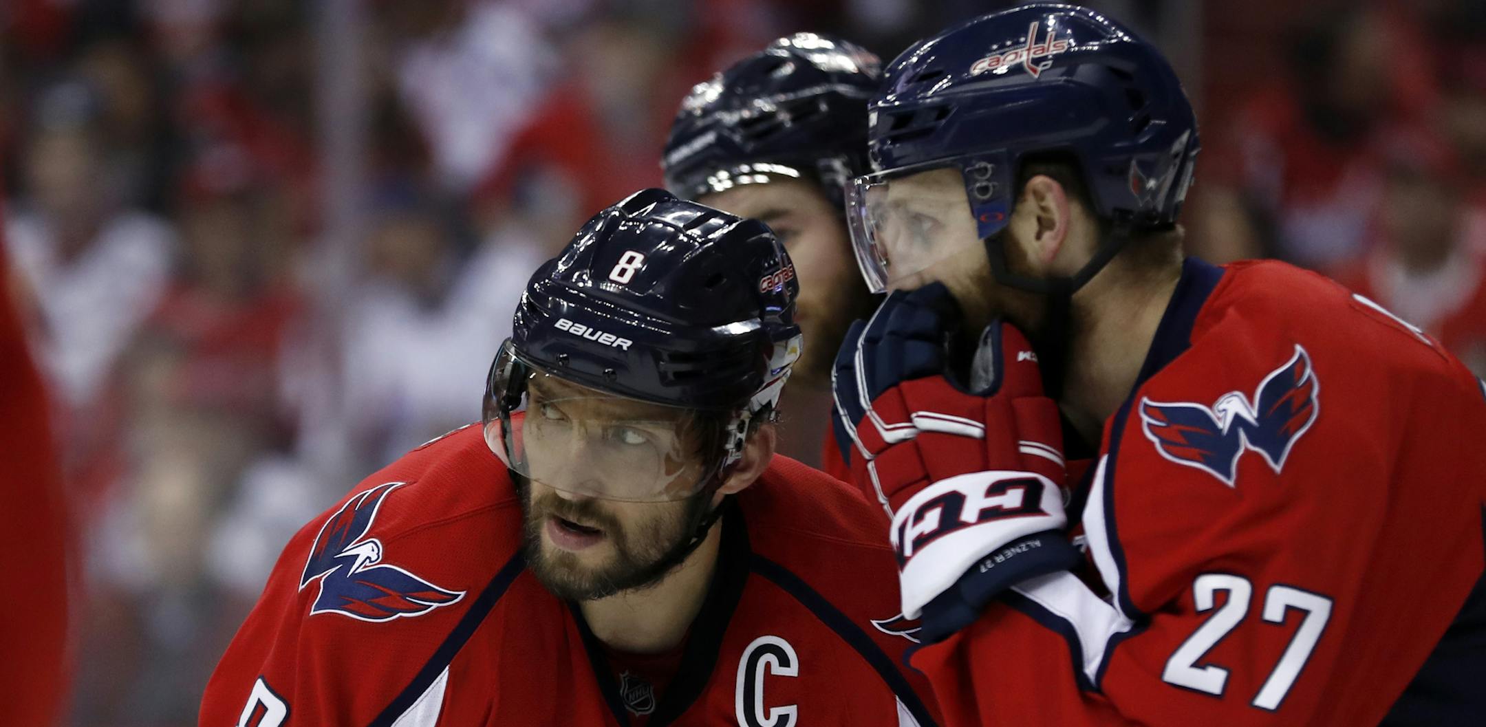Washington Capitals left wing Alex Ovechkin (8), from Russia, listens to Washington Capitals defenseman Karl Alzner (27) during the first period of Game 7 in an NHL Stanley Cup Eastern Conference semifinal hockey game against the Pittsburgh Penguins, Wednesday, May 10, 2017, in Washington. (AP Photo/Alex Brandon)