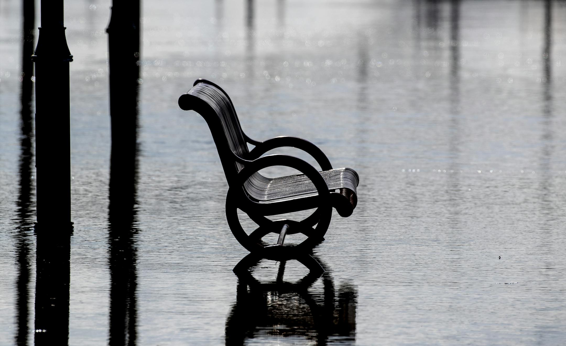 A partially submerged bench at Harriet Island Regional Park on Monday afternoon.