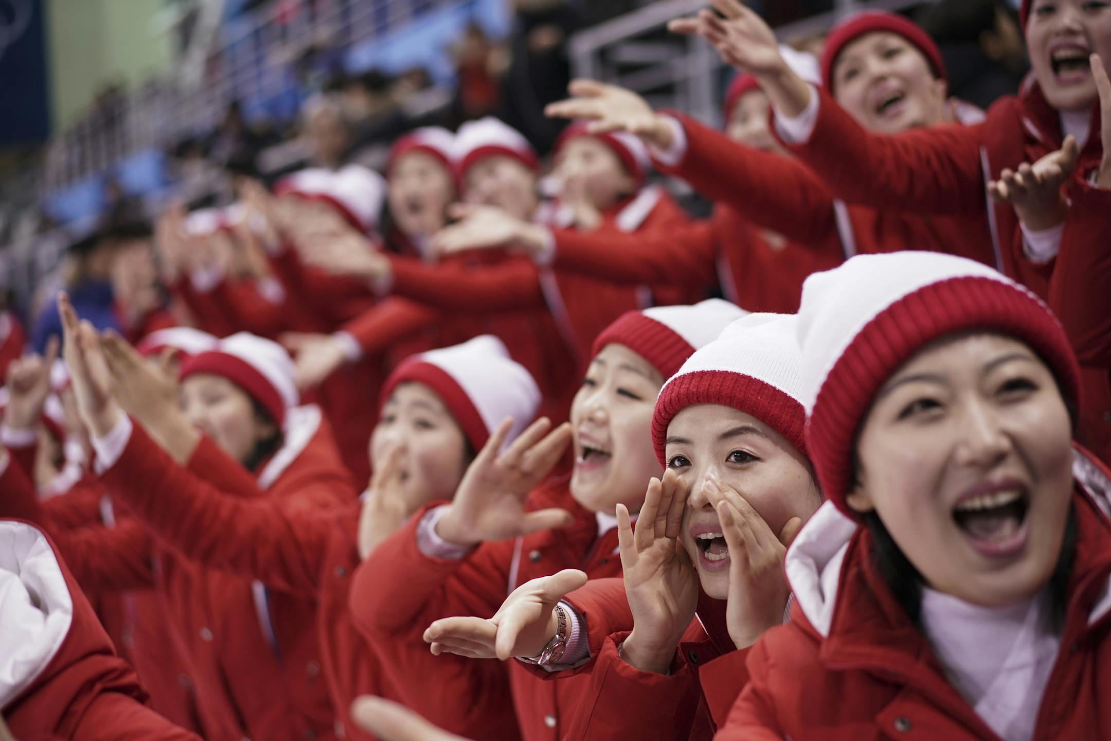North Korean supporters cheer during the preliminary round of the women's hockey game between Switzerland and the combined Koreas at the 2018 Winter Olympics in Gangneung, South Korea, Saturday, Feb. 10, 2018. (AP Photo/Felipe Dana)