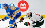 St. Louis Blues' Ryan O'Reilly (90) and Minnesota Wild's Eric Staal (12)