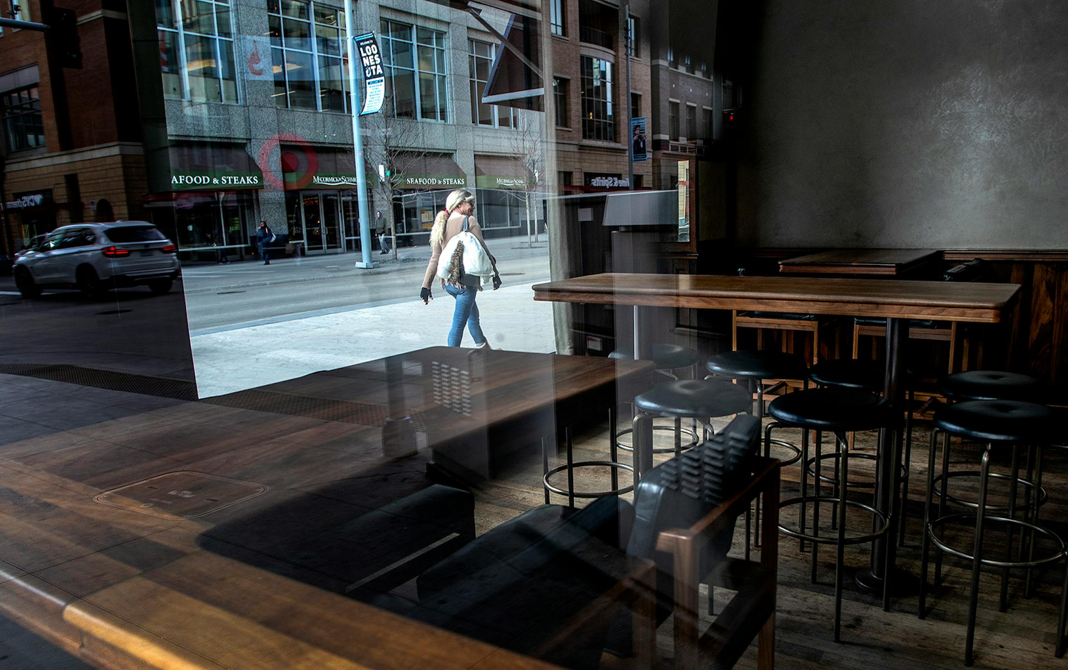 A normally popular corner window spot at Zelo on Nicollet Mall was empty after a state order that closed bars and restaurants.