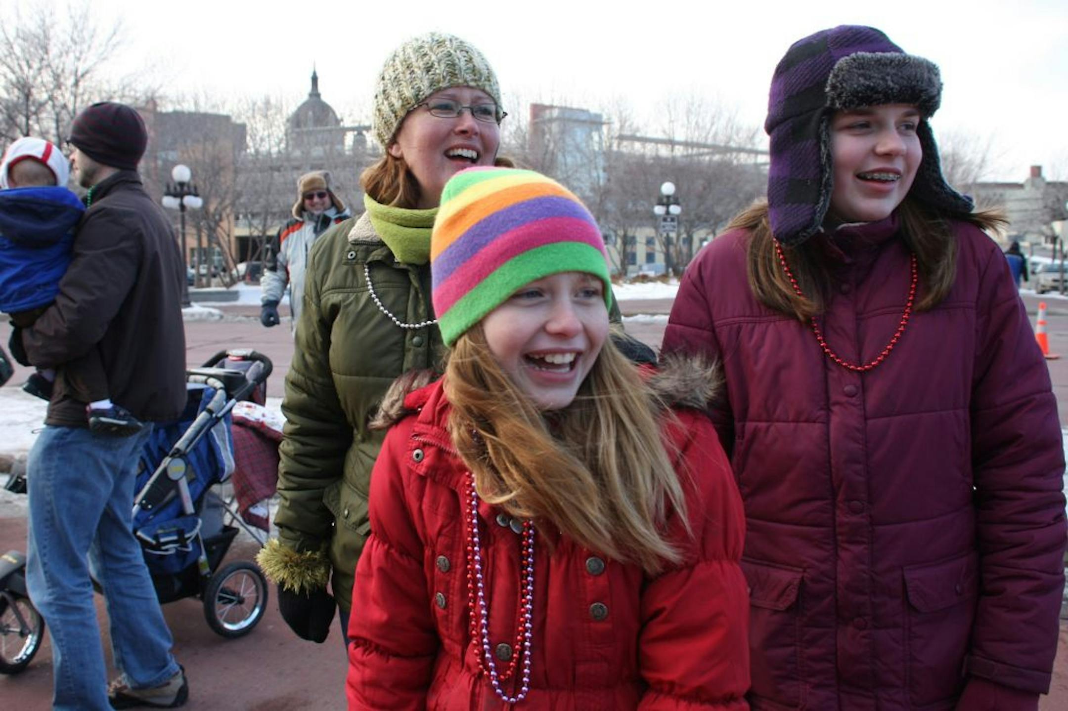 Sara Fleetham (cq/source), left, spent the day with her two nieces, Jordan and Emma Pufahl (cq/source), at the downtown Saint Paul King Boreas Grande Day Parade on Saturday, January 28, 2012. Fleetham doesn't have children but she devotes her time to being a positive influence in her nieces' lives.