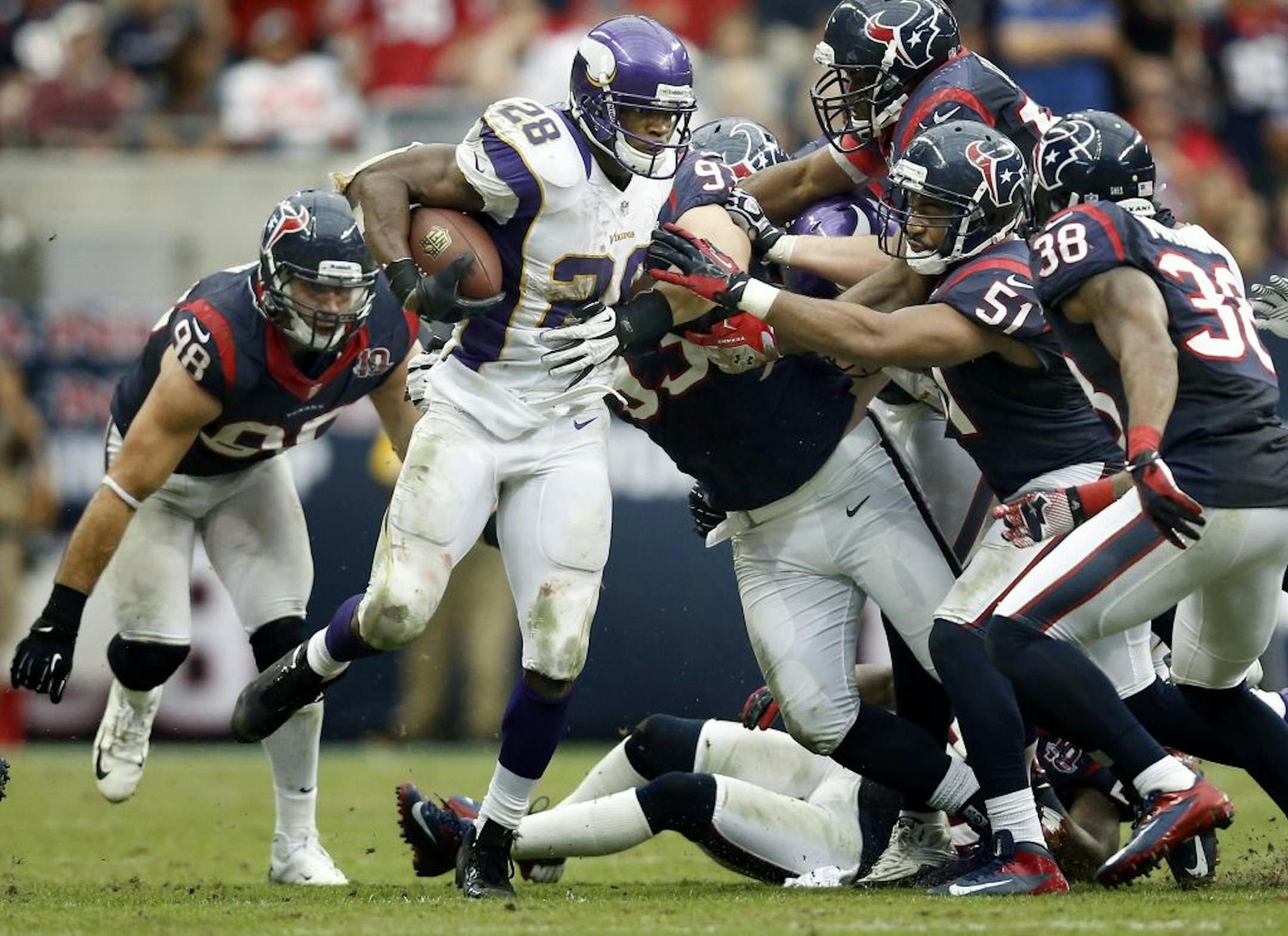 Vikings running back Adrian Peterson saw Texans tacklers coming at him in waves in the fourth quarter Sunsday. He finished with 86 yards, but said he was plenty satisfied with the victory.