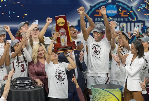 South Carolina head coach Dawn Staley and her team celebrated a 64-49 win over UConn after the championship game in the NCAA Women's Final Four on Sun