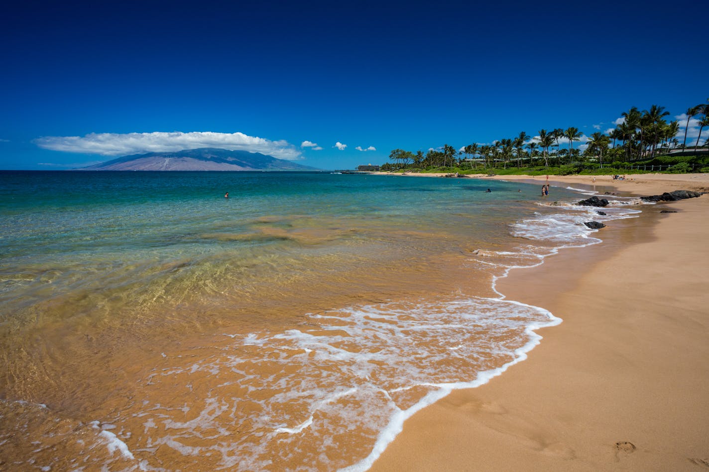 Cool waves wash up on South Maui beach at Wailea, Maui.