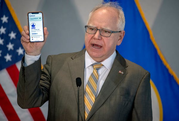 Gov. Tim Walz unveiled the COVIDawareMN mobile tracking app available to Minnesotans during a press conference Monday, Nov. 23, 2020, in St. Paul.