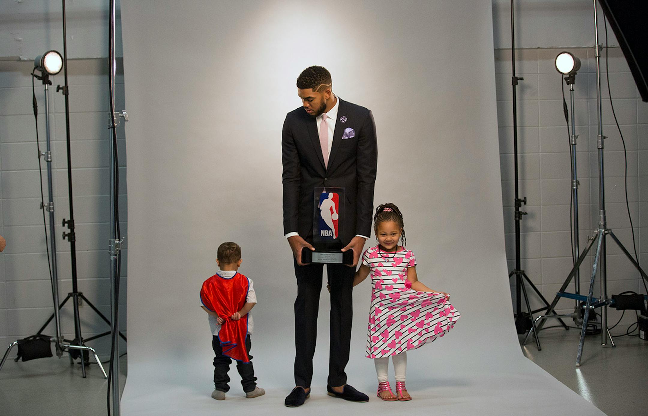 As Karl-Anthony Towns was having his official photographs made by Timberwolves photographer David Sherman, not everyone was happy to participate. Here, KAT's nephew Anthony Maximilian Ammons, 2, was playing hard to get as niece Jolani Ammons, 4, was smiling for the camera.