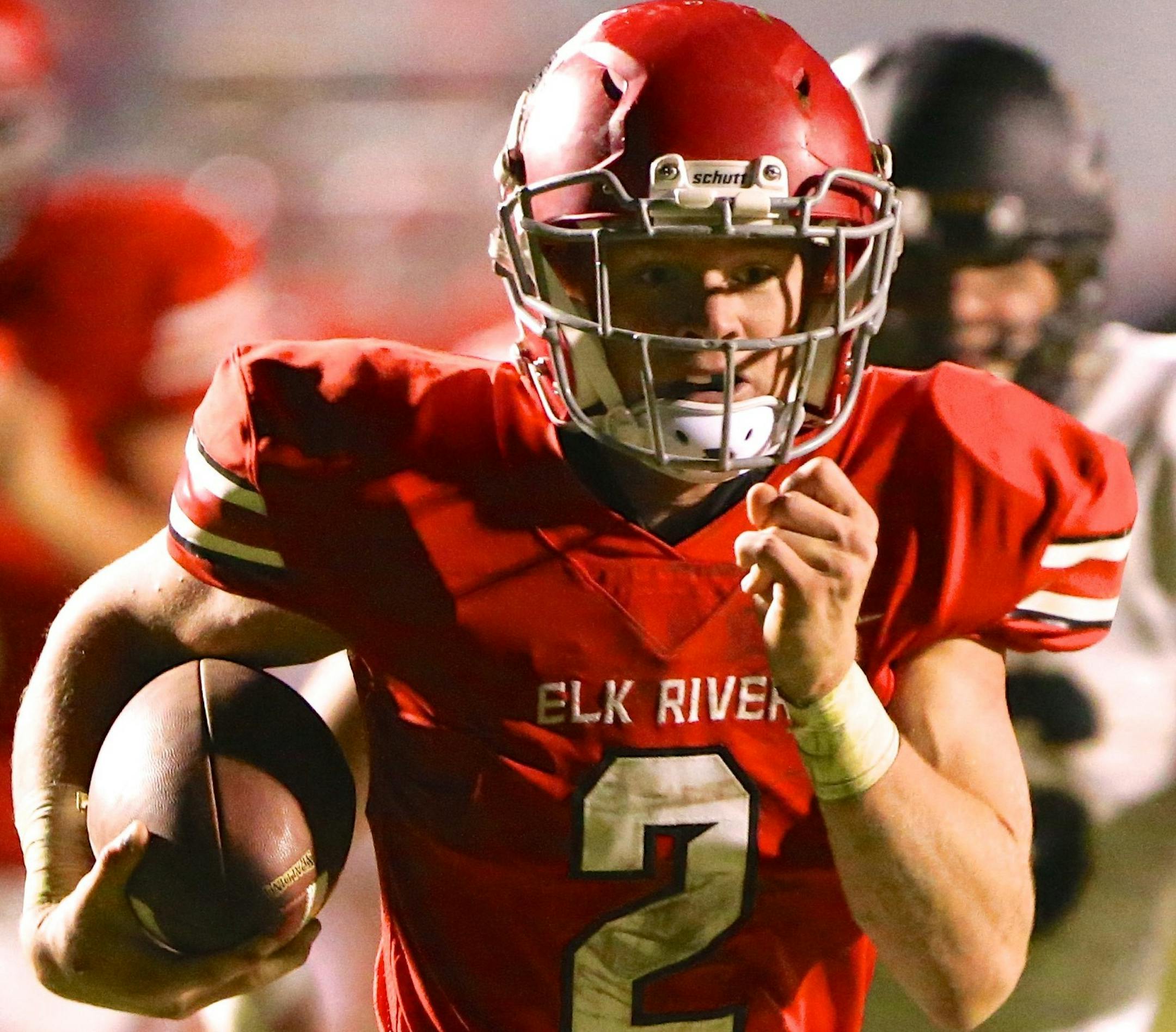 Elk River QB Mitch Stroh gets through the Andover defenders on his way to a 33 yard 2nd quarter touchdown run in the Elkís victory at home over Andover on Friday, October 13th. Photo by Brian W Nelson - SportsEngine