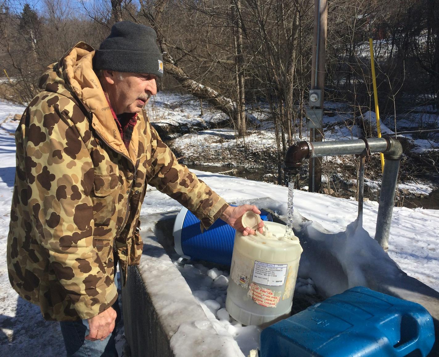 On Thursday morning, Jerry Bielke of Chaska filled up several plastic jugs at the Fredrick-Miller Spring in Eden Prairie. His brother uses the water in his fishtank.