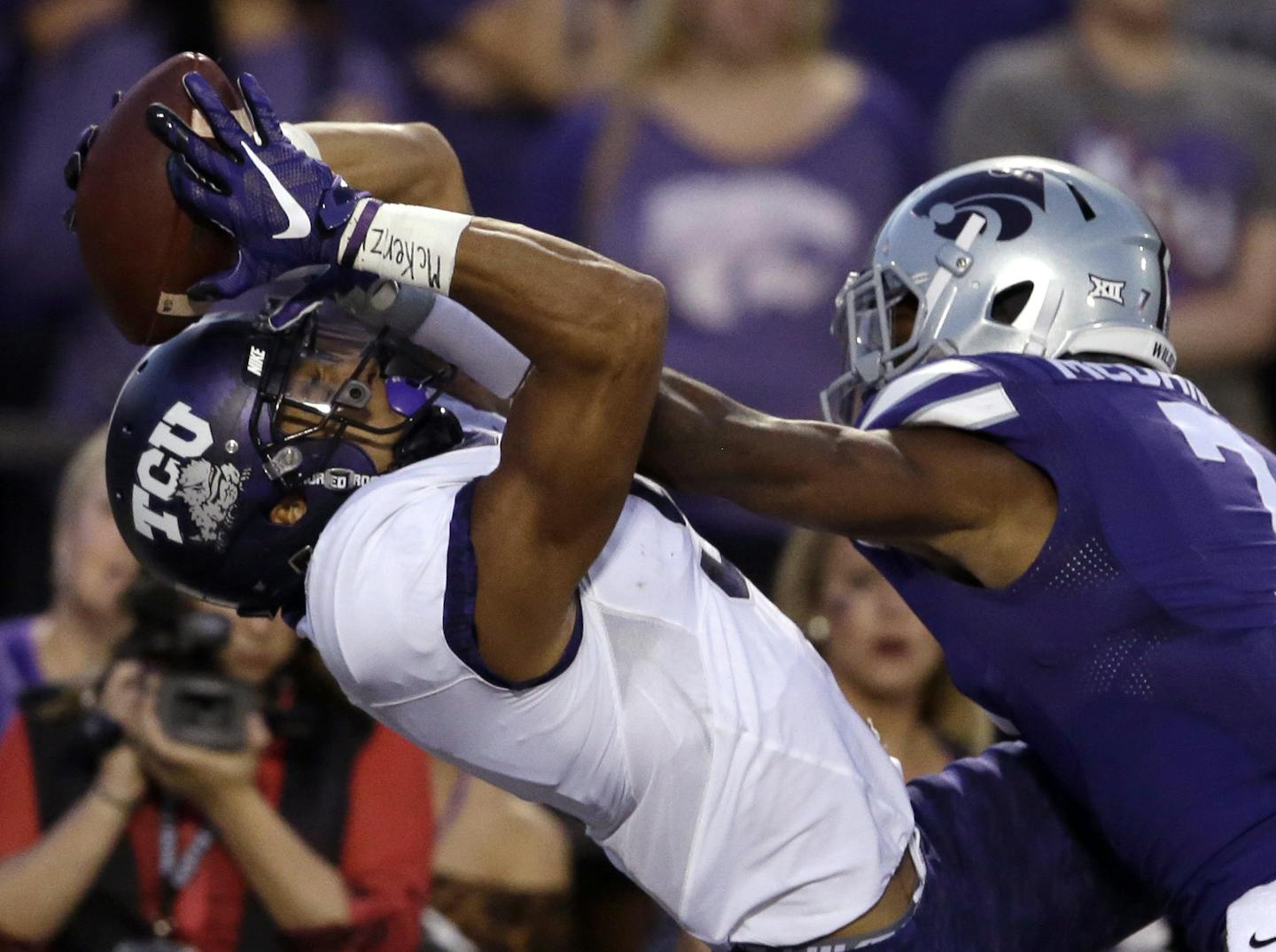 TCU wide receiver Josh Doctson (9) catches a touchdown pass while covered by Kansas State defensive back Danzel McDaniel (7) during the first half of an NCAA college football game in Manhattan, Kan., Saturday, Oct. 10, 2015. (AP Photo/Orlin Wagner)