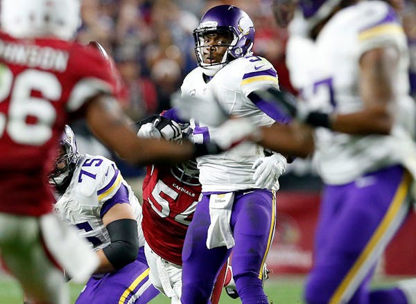 Dwight Freeney (54) stripped Teddy Bridgewater (5) of the ball in the final seconds of the game.