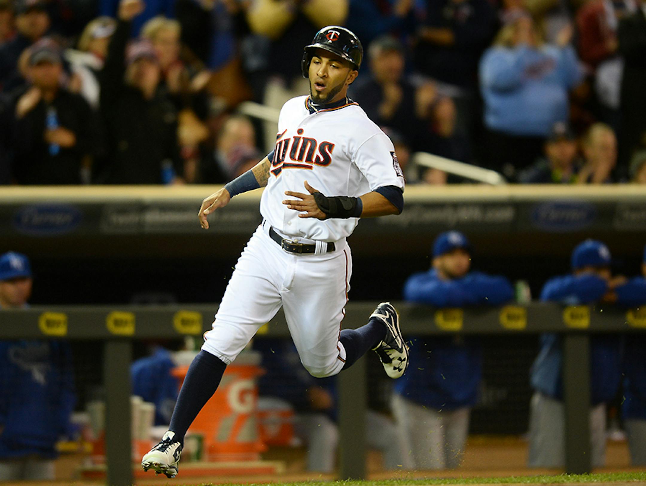 Minnesota Twins left fielder Eddie Rosario (20) ran home to score a run off an RBI by Minnesota Twins center fielder Aaron Hicks (32) in the bottom of the second inning against Kansas City.