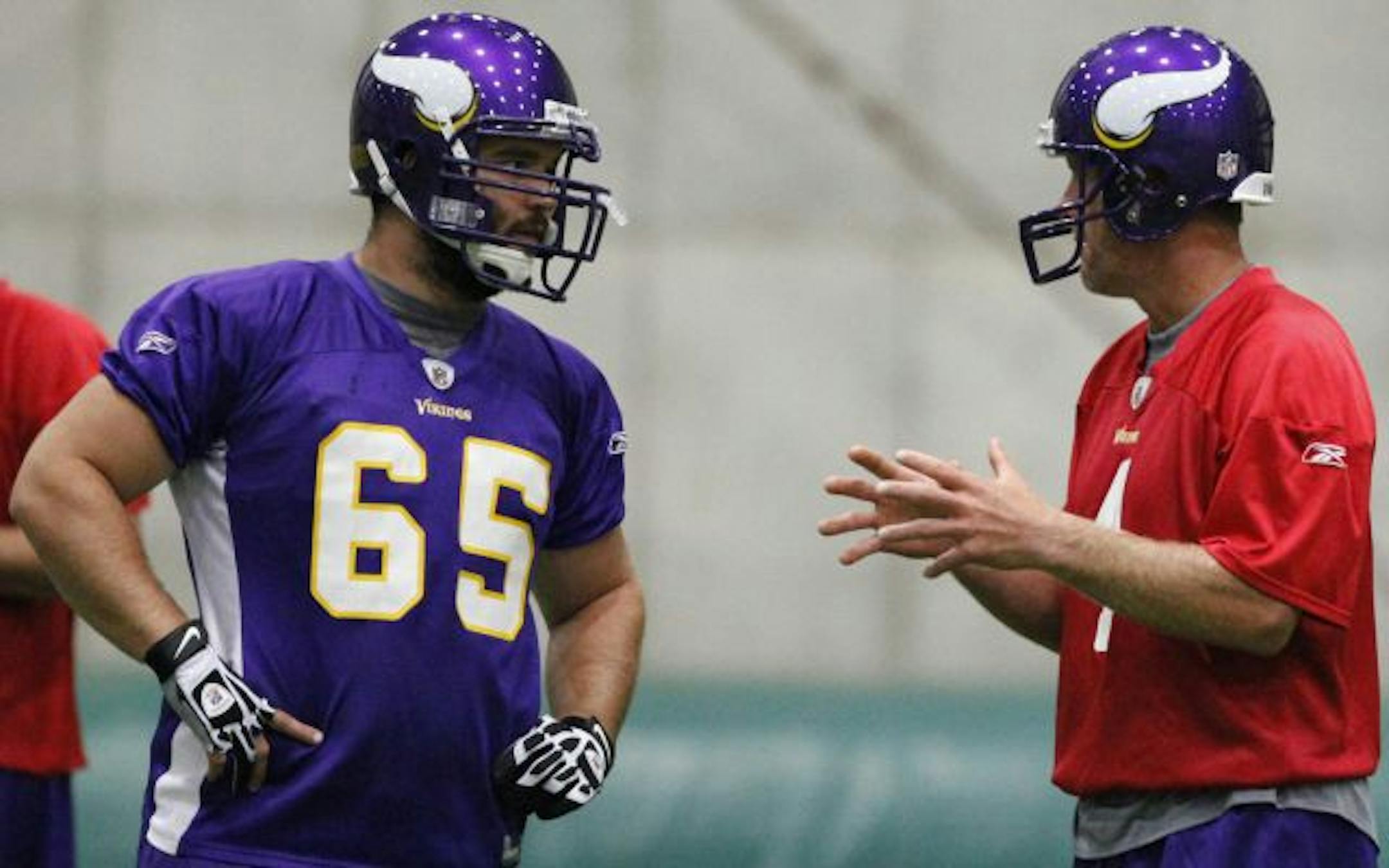 Vikings quarterback Brett Favre chatted with center John Sullivan during Wednesday morning practice.