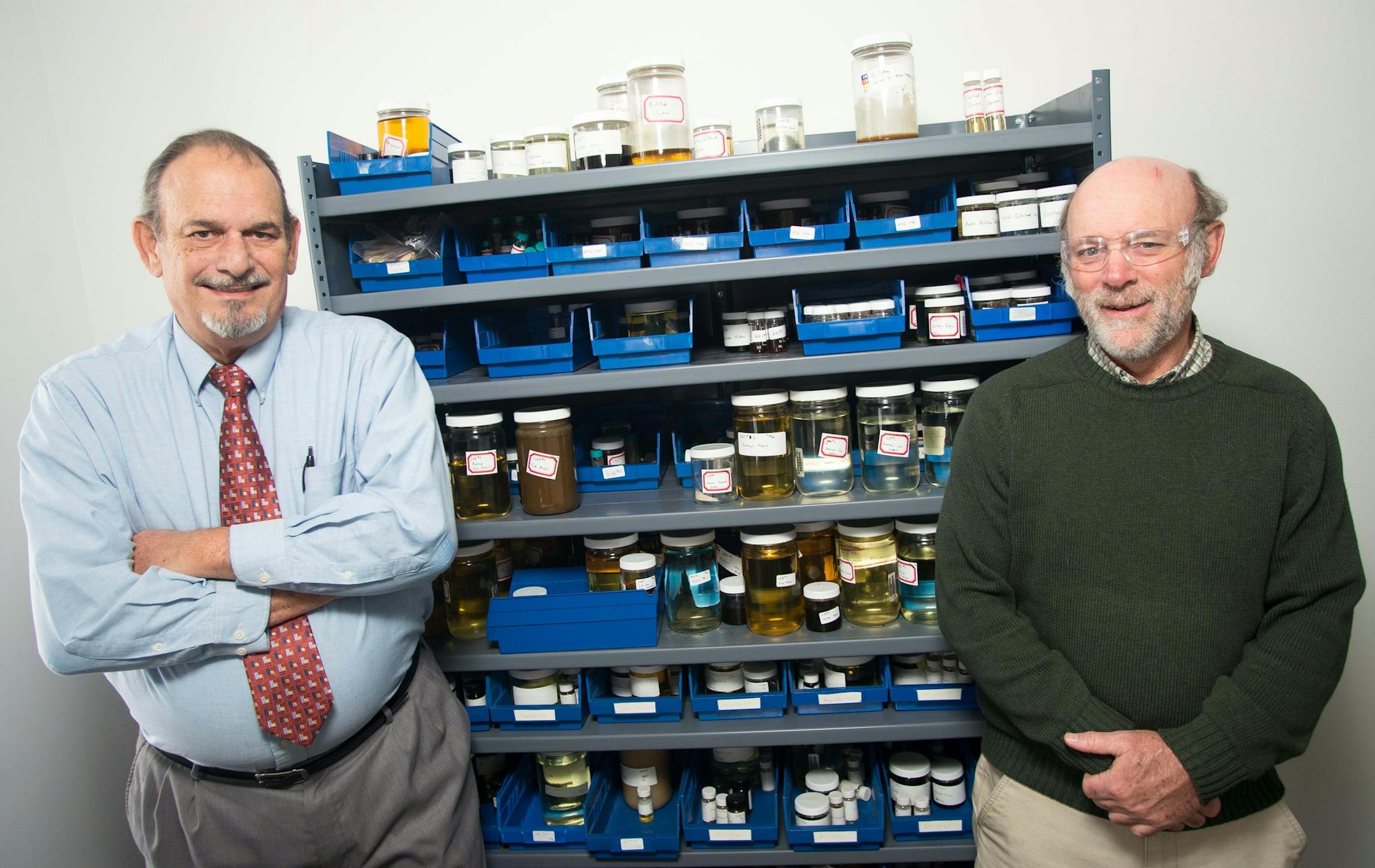 Engineers Joe Valdespino, left, and Kirk Cobb are pictured next to a shelf full of samples of distilled biodiesel, which they say represent hundreds of hours of work by chemists, in the offices of Superior Process Technologies on Tuesday afternoon. ] AARON LAVINSKY • aaron.lavinsky@startribune.com Engineers Kirk Cobb and Joe Valdespino are photographed at Superior Process Technologies, an under-the-radar biofuel research company in northeast Minneapolis, on Tuesday, Nov. 26, 2014. The com