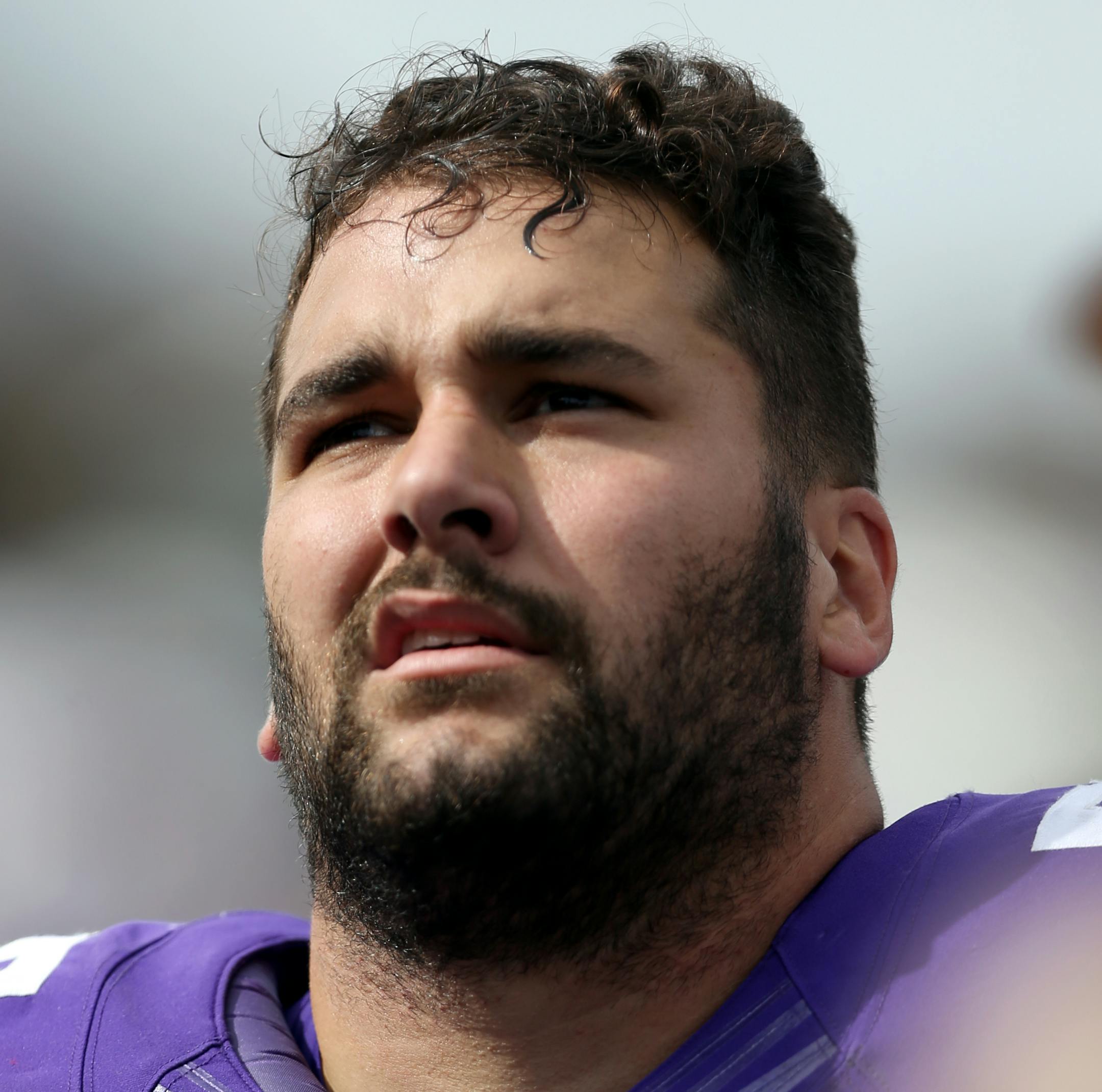 Minnesota Vikings offensive tackle Matt Kalil (75) looks up from the sideline with his helmet off during a NFL football game against the New England Patriots, Sunday, September 14, 2014 in Minneapolis, Minnesota. The Patriots won the game 30-7. (AP Photo/Paul Jasienski) ORG XMIT: PJMN01