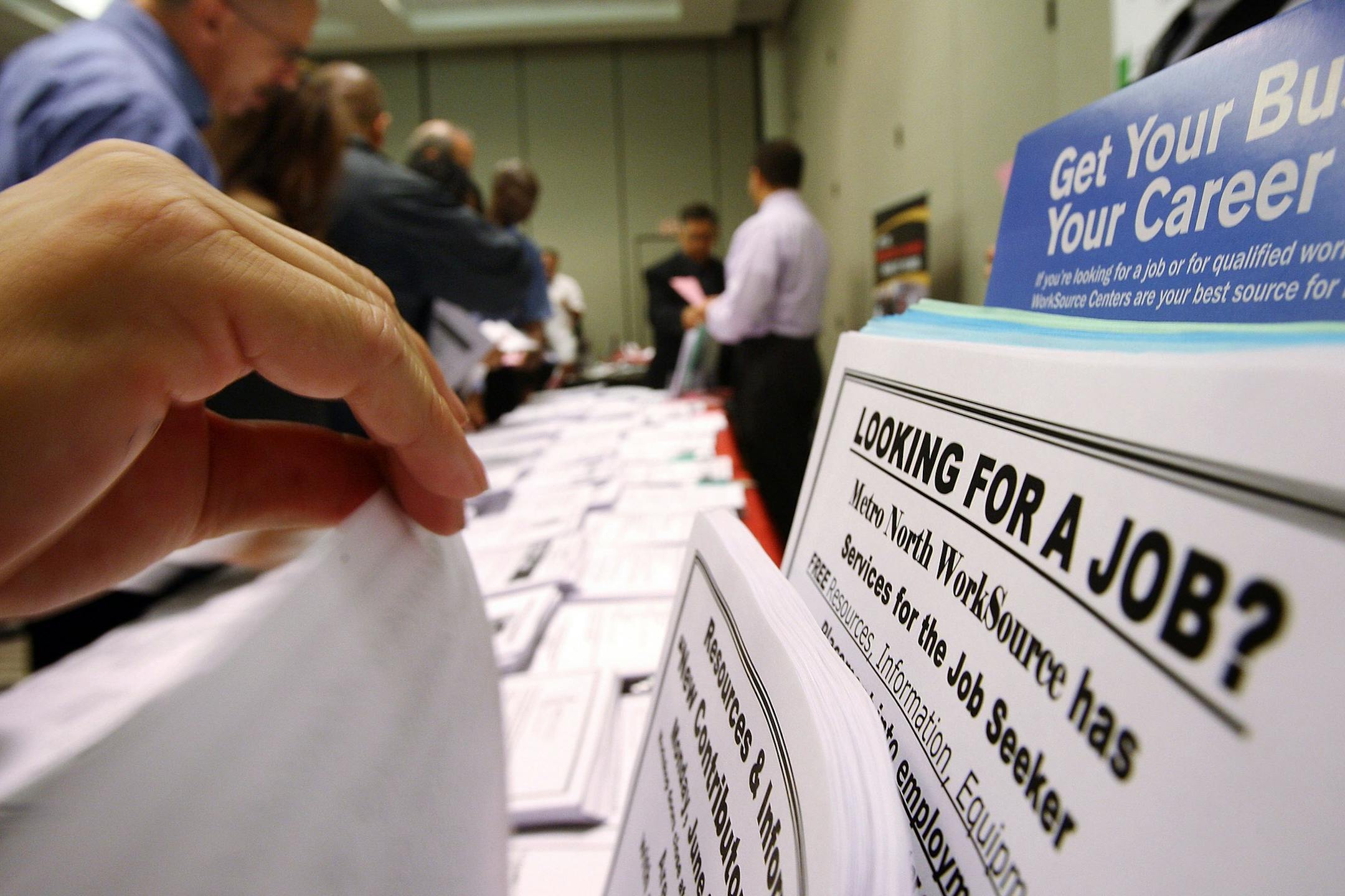 The pandemic recession may soon be over with a giant unemployment rate and a long road back to the economy as it was before. File photo of a career expo in California.