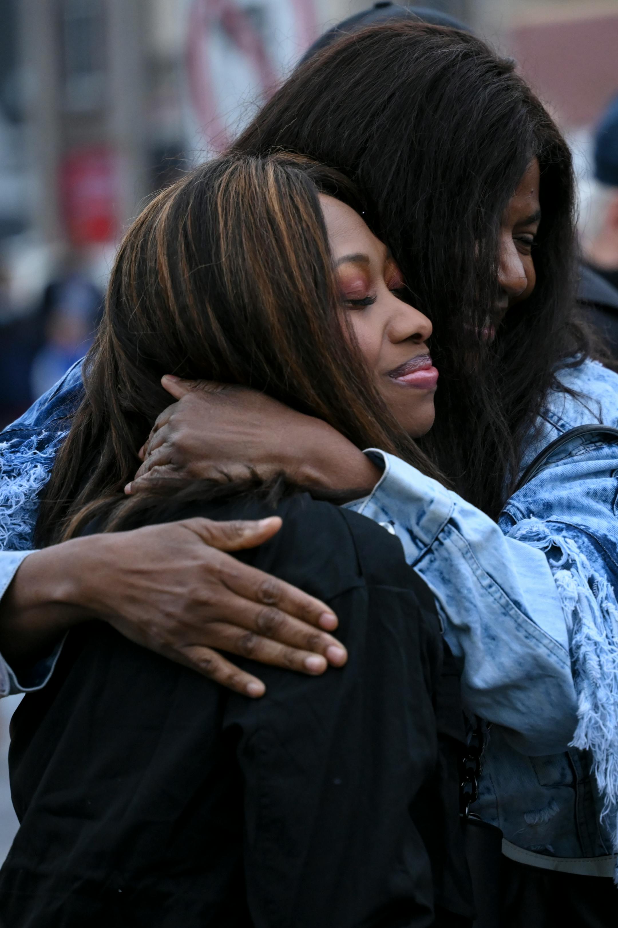 Paris Stevens, cousin of George Floyd, left, embraces Angela Harrelson, Floyd's aunt, at George Floyd Square.