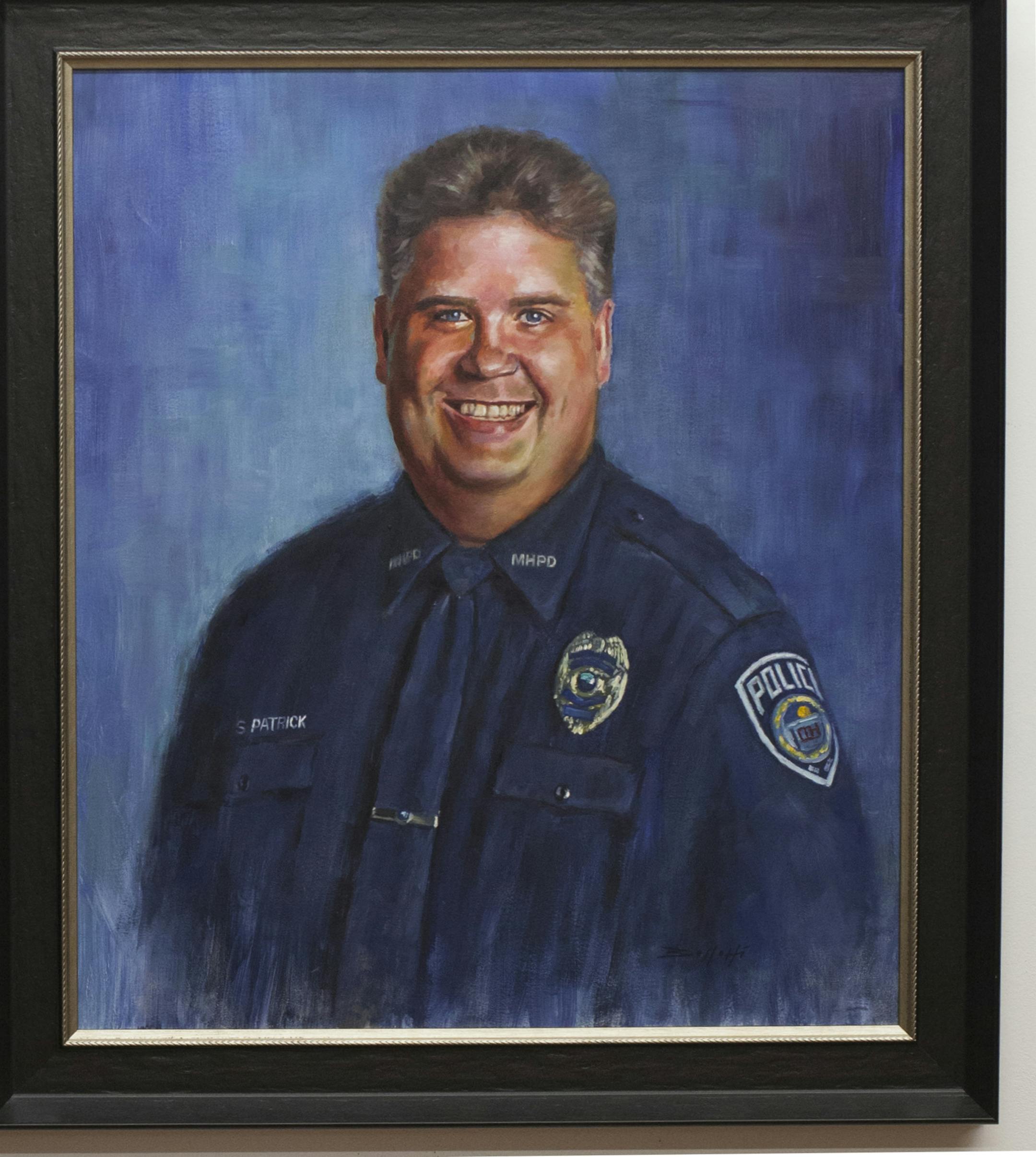 Michael Bellotti used Officer Scott Patrick's official photo as a reference when he painted this oil portrait of him. Photo by Liz Rolfsmeier, Special to the Star Tribune