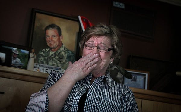 An emotional Barbara Hervas talked about her son, Maj. Tad Hervas. A painting of the soldier and other mementos are on display at Hervas' Coon Rapids 