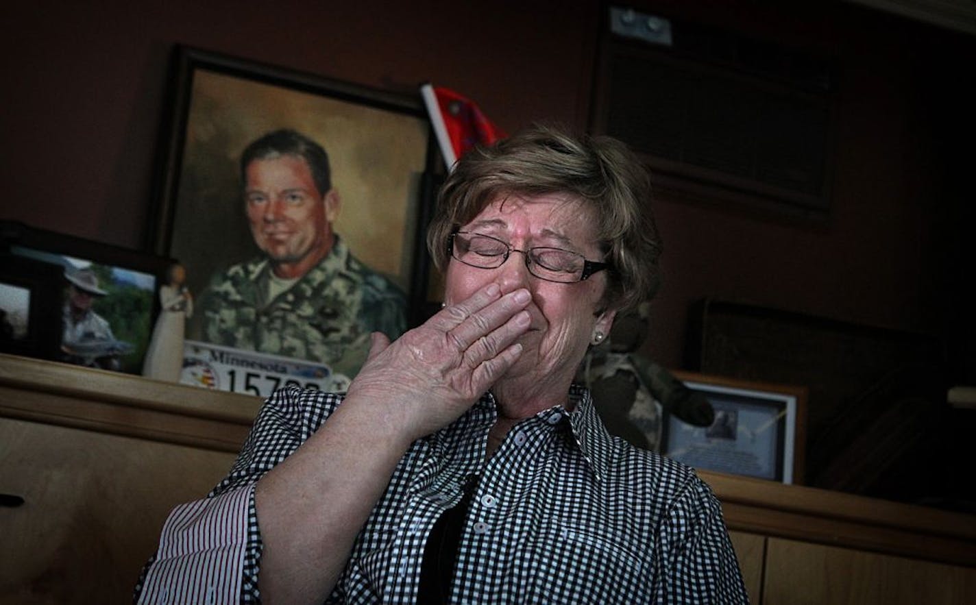 An emotional Barbara Hervas talked about her son, Maj. Tad Hervas. A painting of the soldier and other mementos are on display at Hervas' Coon Rapids home.