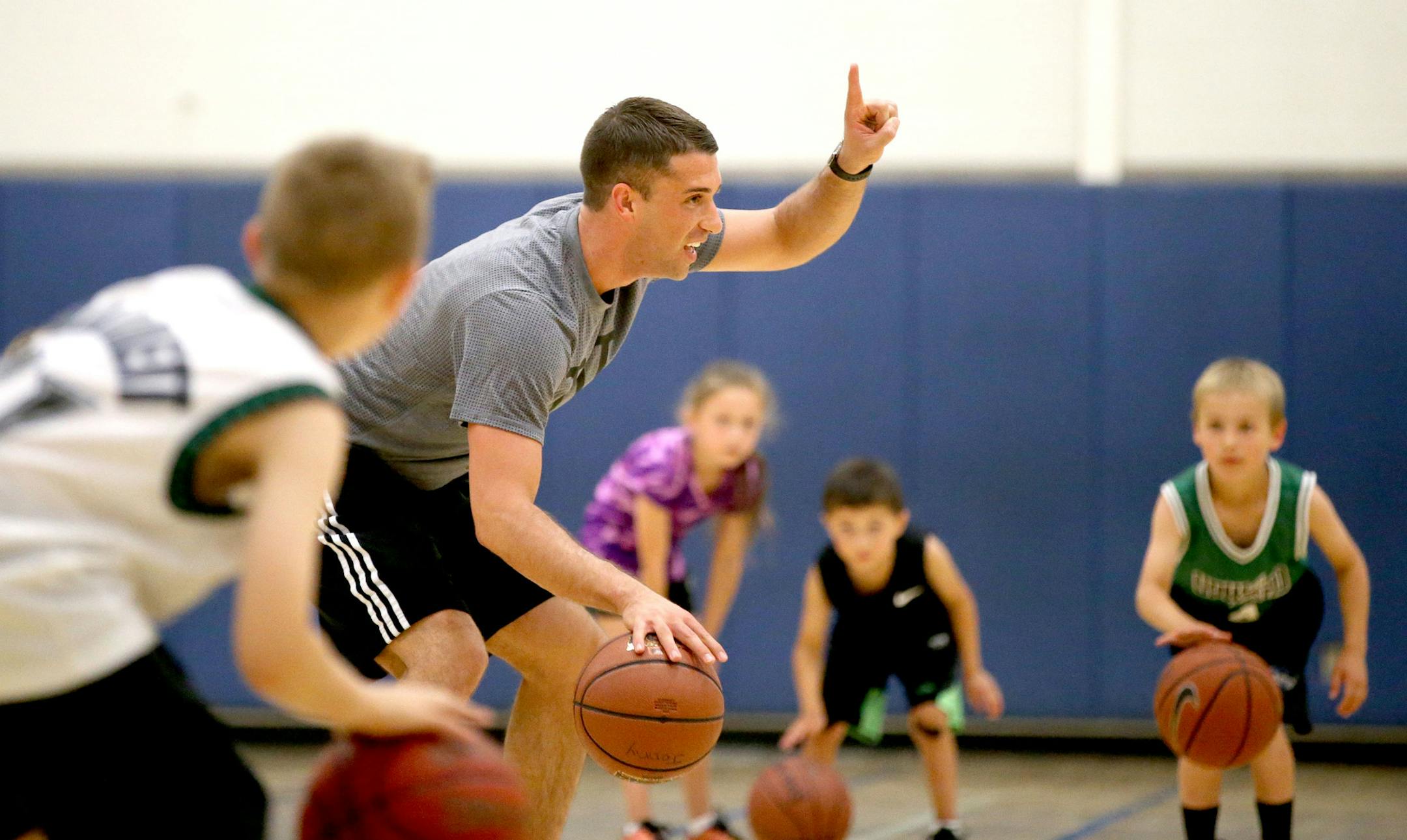 Ryan Saunders, son of Flip Saunders and an assistant basketball coach for the Minnesota Timberwolves, runs a basketball camp named after him Saturday, June 11, 2016 at Wayzata Middle School, in Plymouth, MN. Here, Saunders does a dribbling drill with campers.](DAVID JOLES/STARTRIBUNE)djoles@startribune Patrick Reusse column on Ryan Saunders, son of Flip Saunders, for father's day.