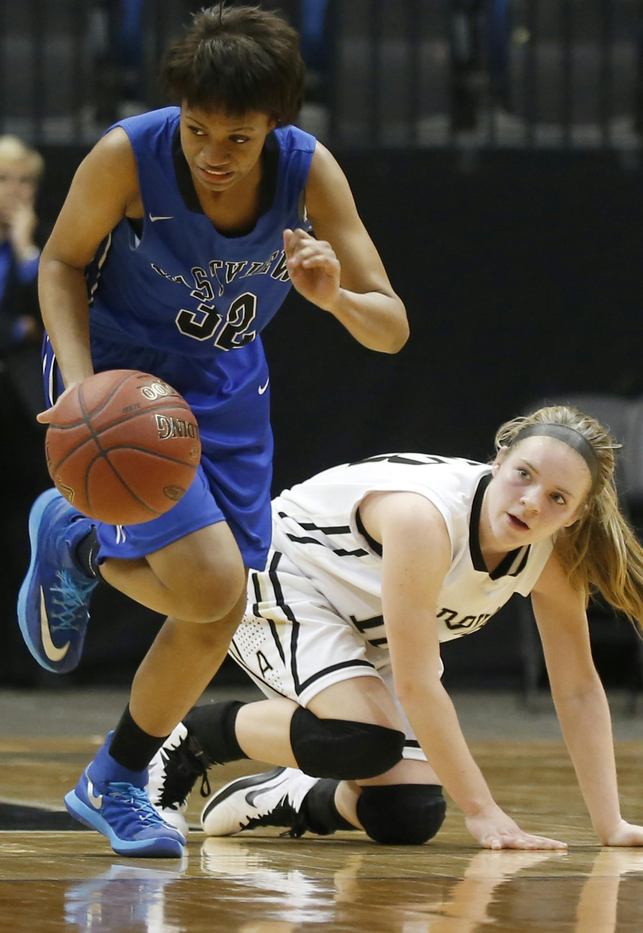 Eastview's Mina Sete stole the ball away from Andover's Hailey Diemer during the second half. ] (KYNDELL HARKNESS/STAR TRIBUNE) kyndell.harkness@startribune.com Eastview vs Andover in the quarterfinals at the Target Center in Minneapolis Min., Tuesday, March 17, 2015. East view won over Andover 62-28