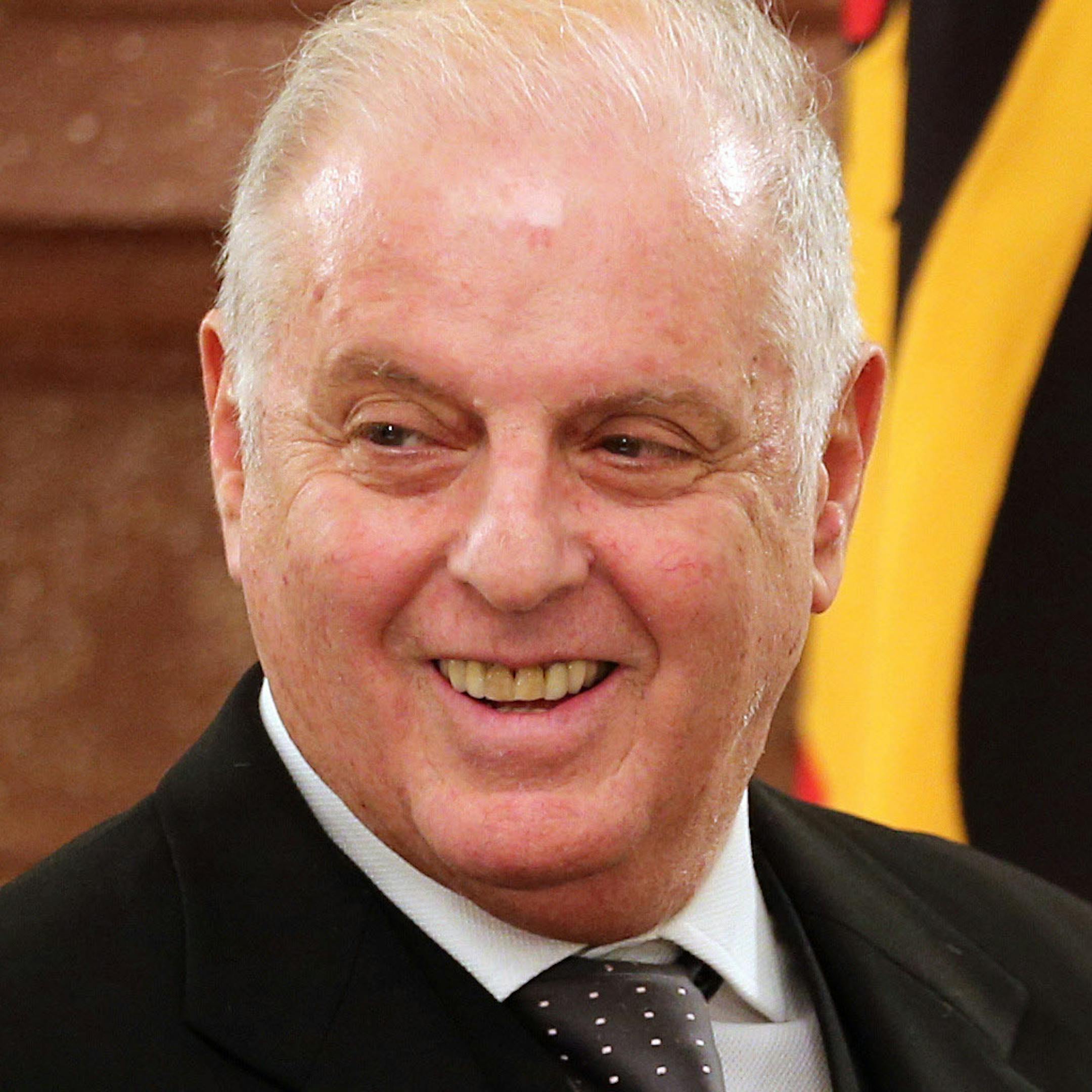 In this photo made available Wednesday, Feb. 6, 2013, German President Joachim Gauck, right, presents the Order of Merit of the Federal Republic of Germany Music Director of the Berlin State Opera Daniel Barenboim, left, at Bellevue Palace in Berlin, Germany. The Argentine-Israeli conductor and pianist was awarded the Grand Merit Cross with Star and Sash on the occasion of his 70th Birthday. (AP Photo/dpa, Wolfgang Kumm) ORG XMIT: MIN2013030809381211