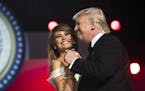 FILE -- President Donald Trump dances with first lady Melania Trump at the Freedom Ball after his inauguration in Washington, Jan. 20, 2017. New detai