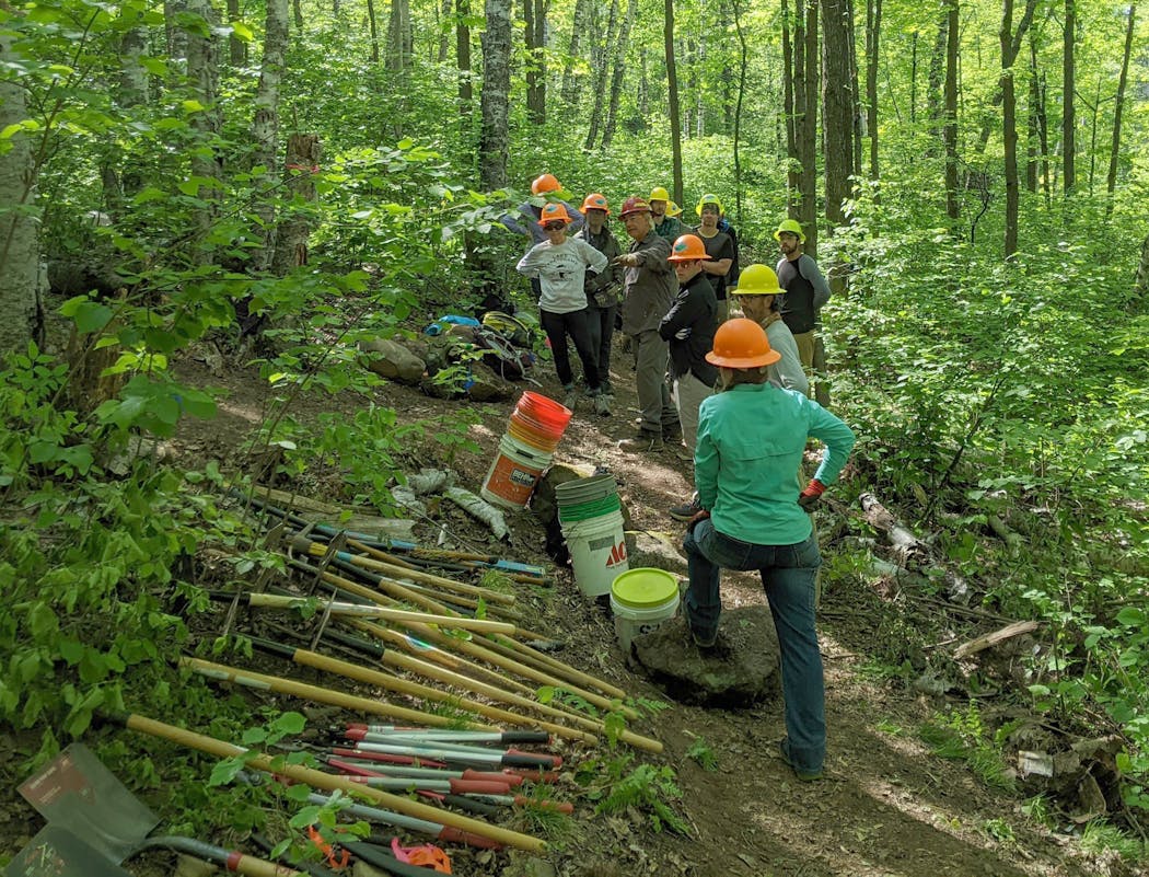 Volunteers got direction on trail-building above Bean and Bear lakes along the Superior Hiking Trail near Silver Bay, Minn., during a workday June 18.