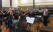 Timothy Mahr conducted the Roseville Area High School Symphonic Band in a rehearsal of his Symphony No. 1.