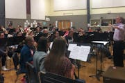 Timothy Mahr conducted the Roseville Area High School Symphonic Band in a rehearsal of his Symphony No. 1.