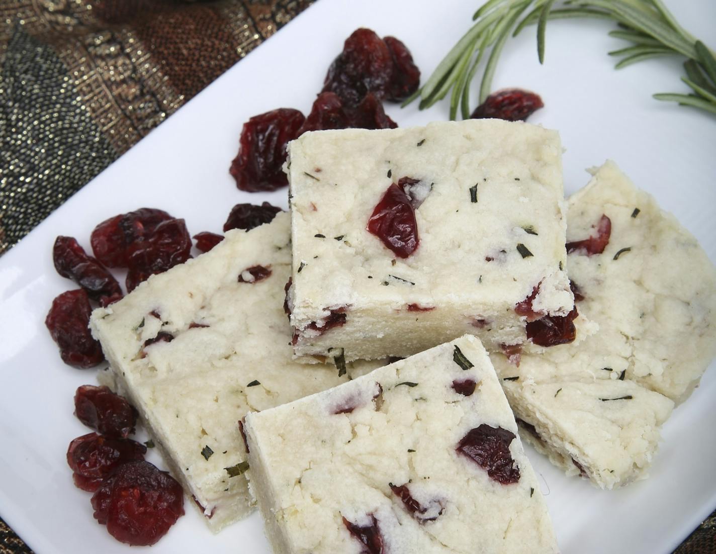 Shortbread with rosemary, dried cranberries and goat cheese is a savory, slightly sweet, festive appetizer for the holidays.